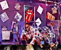 a man is playing a guitar